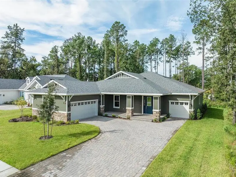 Front exterior of a new home in Southern Hills Plantation, Brooksville, FL, highlighting curb appeal (Image 1). Front exterior of a new home in Southern Hills Plantation, Brooksville, FL, highlighting curb appeal (Image 1).
