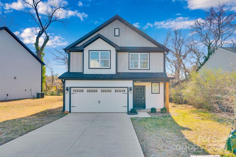 Front exterior of a new home in , Charlotte, NC, highlighting curb appeal (Image 26).