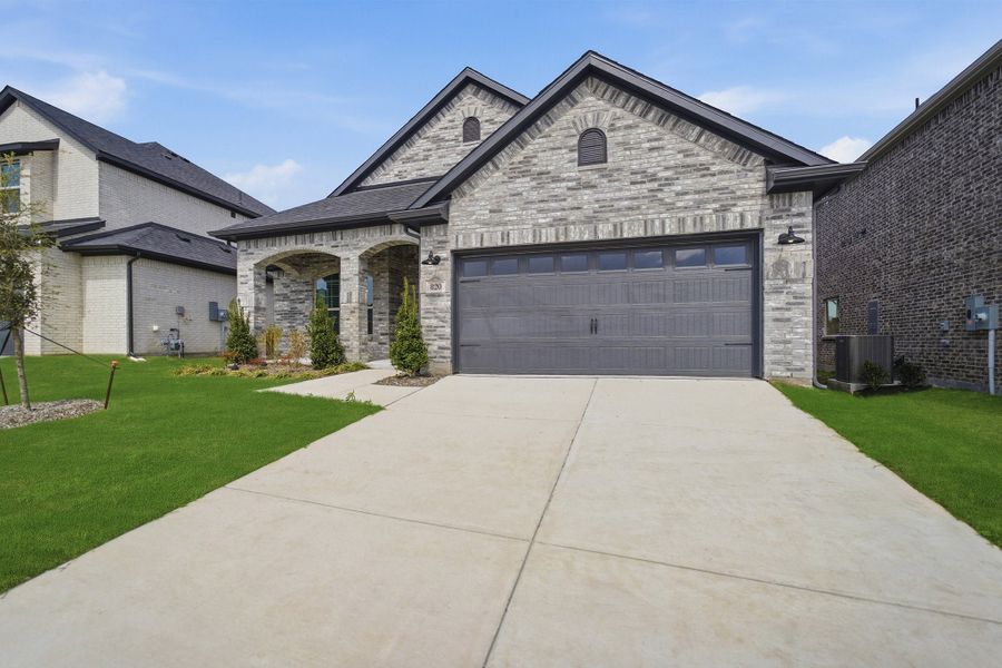 Front exterior of a new home in Westridge, McKinney, TX, highlighting curb appeal (Image 2). Front exterior of a new home in Westridge, McKinney, TX, highlighting curb appeal (Image 2).