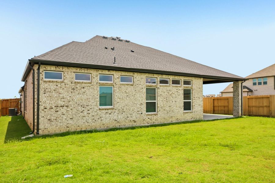 Exterior details and patio area of a home in Riceland 60',65',70', Old River-Winfree (Image 3).
