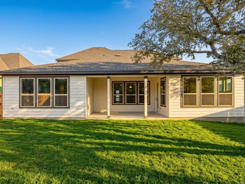 Exterior details and patio area of a home in The Reserve at Potranco Oaks, Castroville (Image 3).