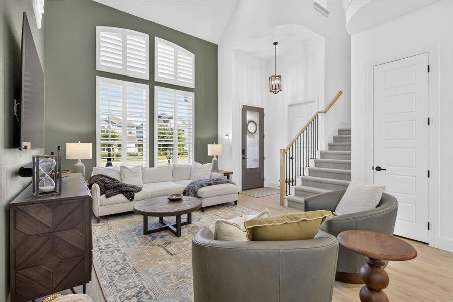 The designer paint and plantation shutters on EVERY WINDOW create a rich, inviting space. Laundry by the front door! LOTS of storage under the stairs! The designer paint and plantation shutters on EVERY WINDOW create a rich, inviting space. Laundry by the front door! LOTS of storage under the stairs!