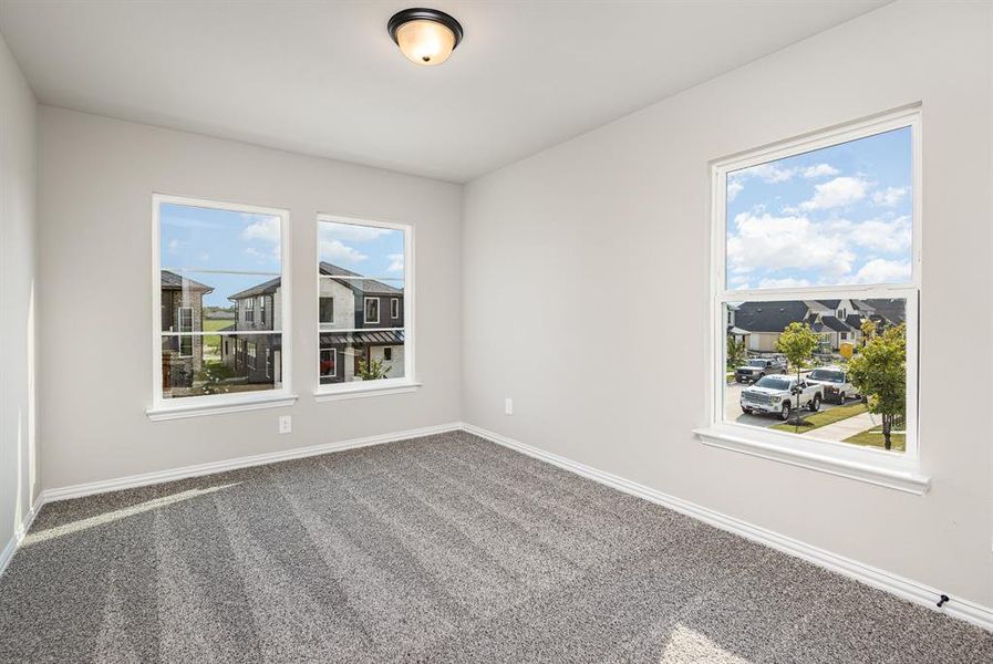 Empty room with baseboards and carpet flooring