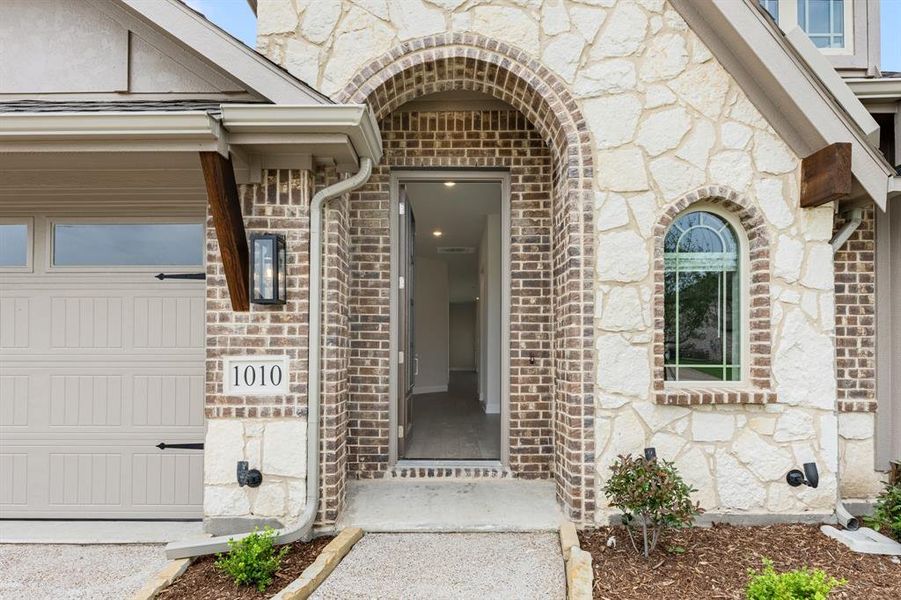Front exterior of a new home in Legacy Ranch Classic 55, Melissa, TX, highlighting curb appeal (Image 25). Front exterior of a new home in Legacy Ranch Classic 55, Melissa, TX, highlighting curb appeal (Image 25).