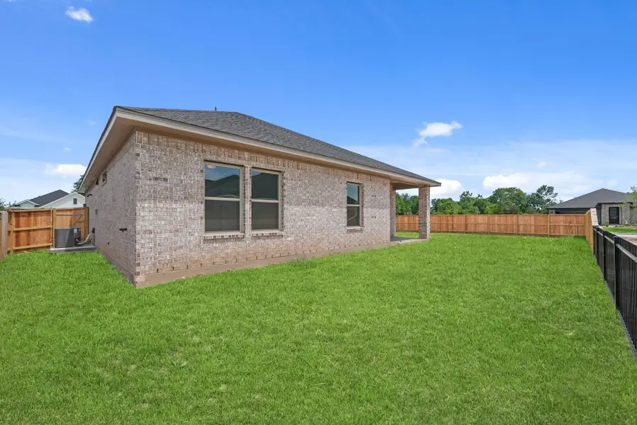Exterior details and patio area of a home in Laurel Landing, Alvin (Image 22). Exterior details and patio area of a home in Laurel Landing, Alvin (Image 22).