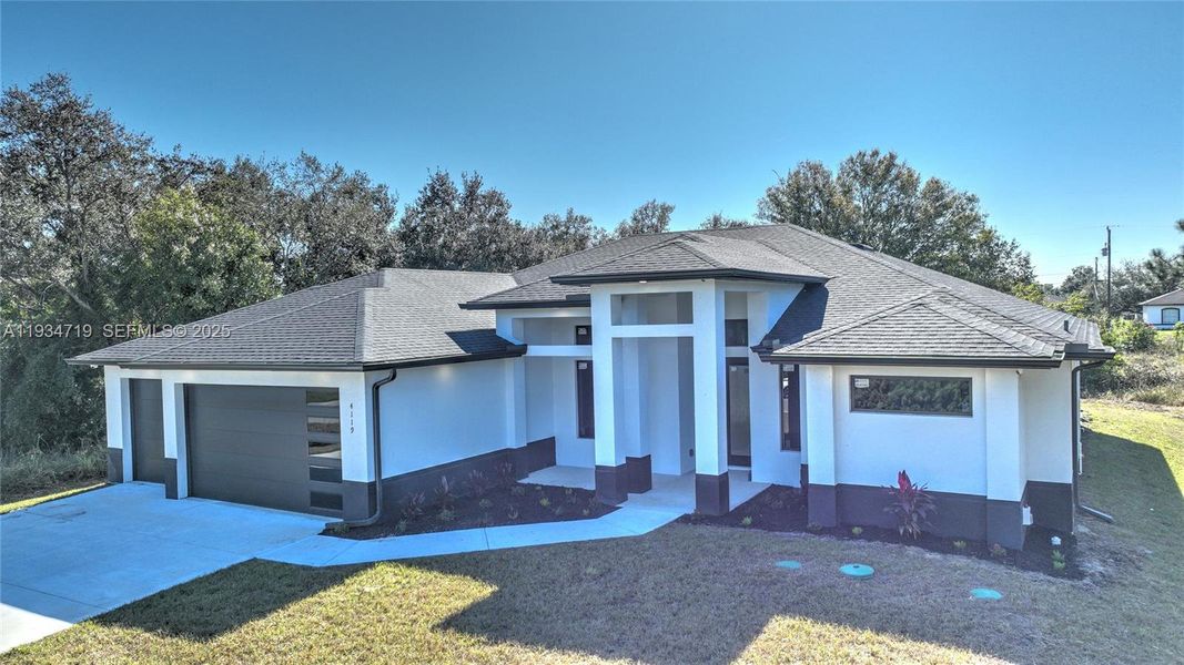 Front exterior of a new home in , Lehigh Acres, FL, highlighting curb appeal (Image 29).