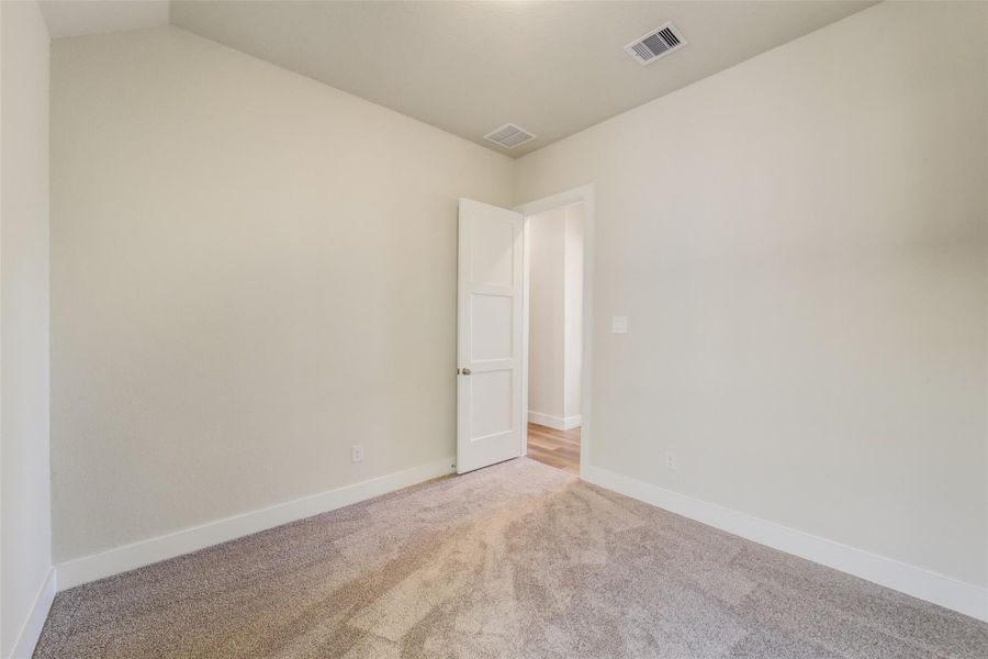 Spacious, unfurnished interior of a new home in Sunterra, Katy (Image 36).