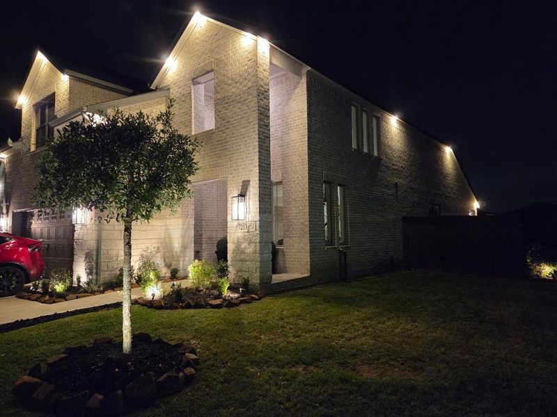 Front exterior of a new home in The Trails, New Caney, TX, highlighting curb appeal (Image 29).