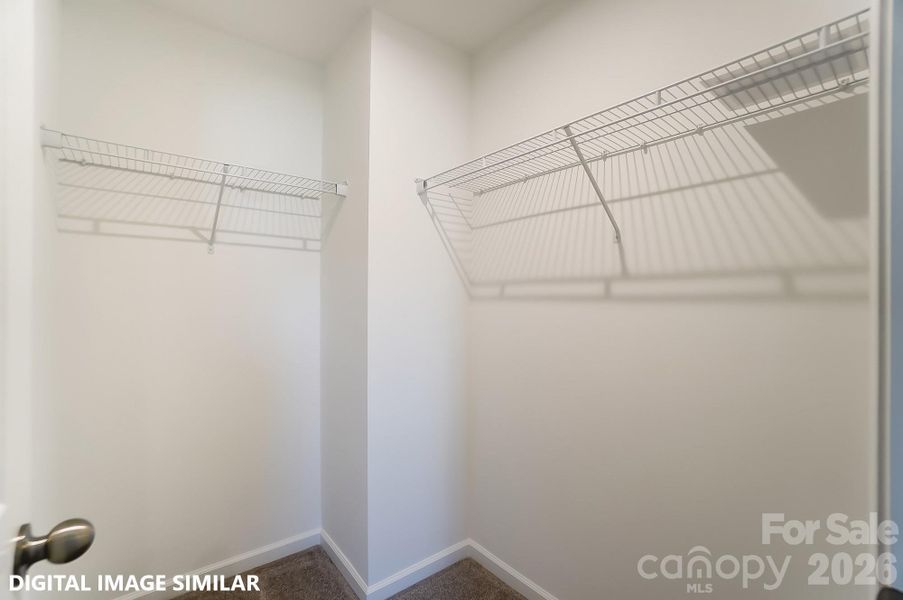 BEDROOM TWO WALK-IN CLOSET (UPPER LEVEL) - Photo is for representation purposes of floorplan only - colors, finishes, and options will vary