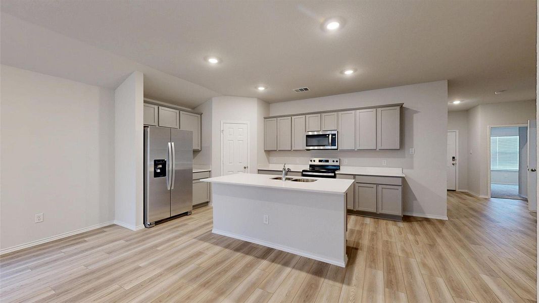 A well-appointed kitchen showcasing contemporary finishes and practical design.