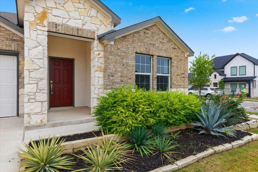 Exterior details and patio area of a home in Thunder Rock: Watermill Collection, Marble Falls (Image 4).