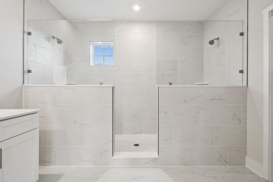 A bathroom with a tile floor.