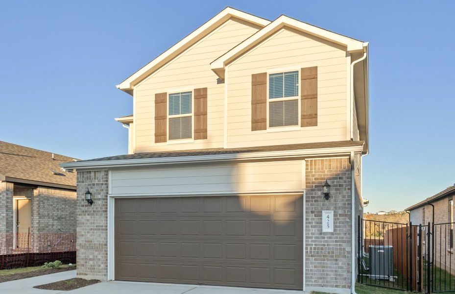 Front exterior of a new home in Saddleback at Santa Rita Ranch, Liberty Hill, TX, highlighting curb appeal (Image 17). Front exterior of a new home in Saddleback at Santa Rita Ranch, Liberty Hill, TX, highlighting curb appeal (Image 17).