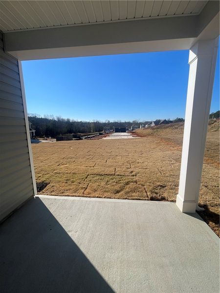 Exterior details and patio area of a home in Springwood Grove, Central (Image 19).