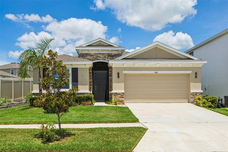 Front exterior of a new home in Epperson, Wesley Chapel, FL, highlighting curb appeal (Image 2). Front exterior of a new home in Epperson, Wesley Chapel, FL, highlighting curb appeal (Image 2).