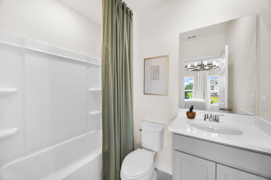 Representative furnished interior of a home built from the Finn by Risewell Homes in Eagletail Landings, Howey-in-the-Hills (Image 14).