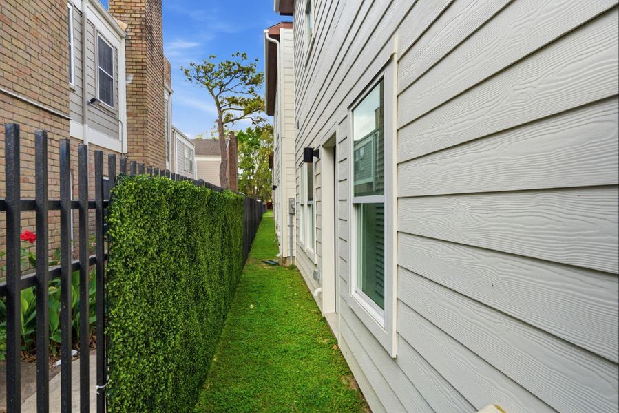 Back green space just enough space for a potty pad or grill.