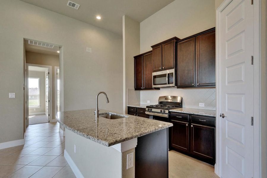 Representative furnished interior of a home built from the Oaks 1793 by Brohn Homes in Oaks at San Gabriel, Georgetown (Image 5).