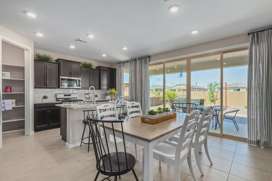 Representative furnished interior of a home built from the 1603 by Elliott Homes in Acacia at Santana, Yuma (Image 8).