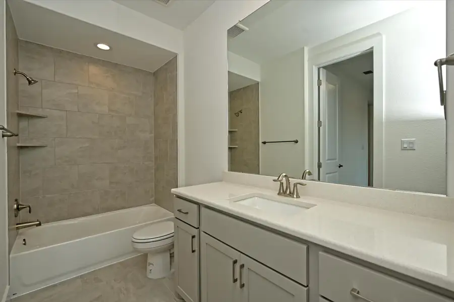 Representative furnished interior of a home built from the Llano II by Giddens Homes in Whispering Wind, Bertram (Image 63). Representative furnished interior of a home built from the Llano II by Giddens Homes in Whispering Wind, Bertram (Image 63).