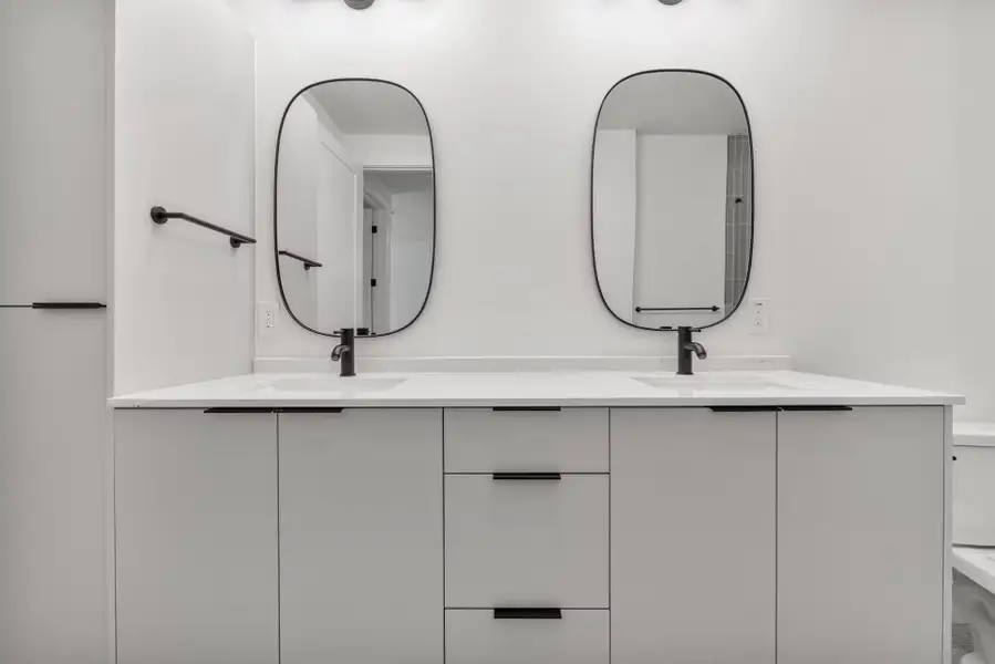 Full bathroom featuring double vanity