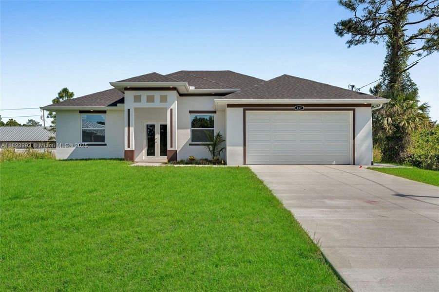 Front exterior of a new home in , Lehigh Acres, FL, highlighting curb appeal (Image 18). Front exterior of a new home in , Lehigh Acres, FL, highlighting curb appeal (Image 18).