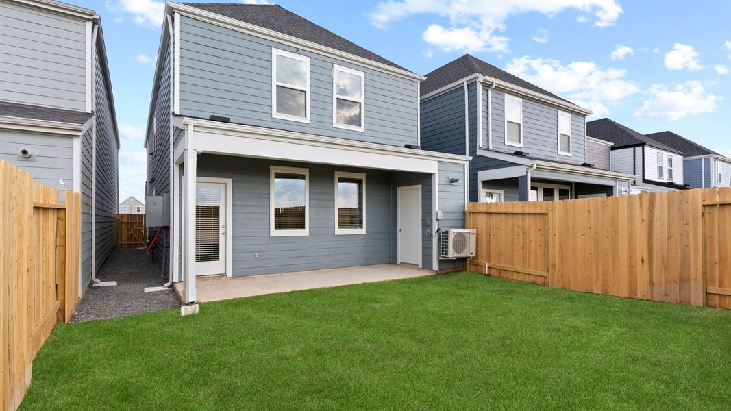 Exterior details and patio area of a home in Villarosa at Tamarron, Katy (Image 28).