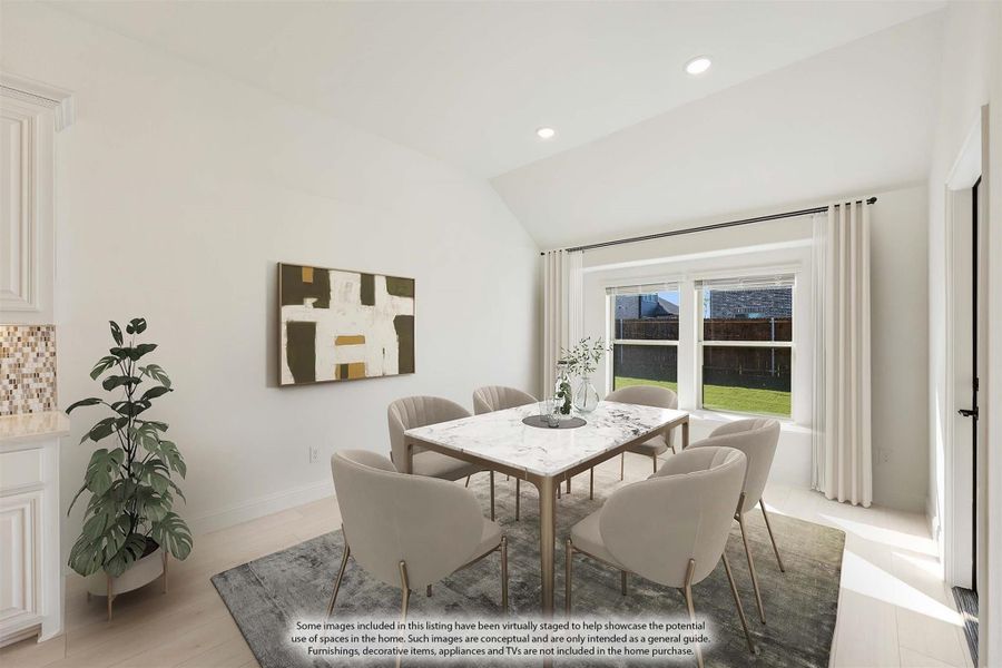 Dining room with marble table, six chairs, vaulted ceiling, and large window overlooking backyard Dining room with marble table, six chairs, vaulted ceiling, and large window overlooking backyard