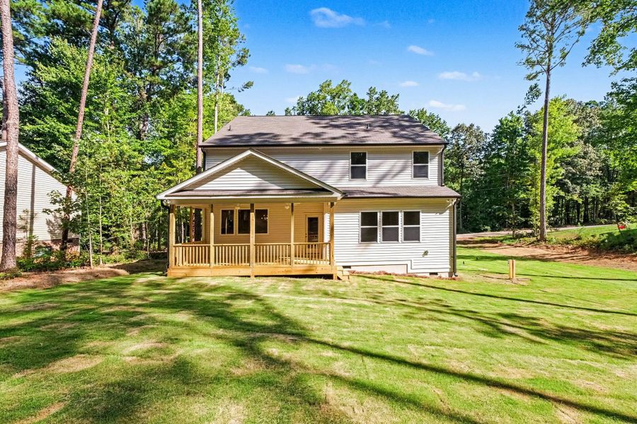 Exterior details and patio area of a home in Lake Royale, Louisburg (Image 2).