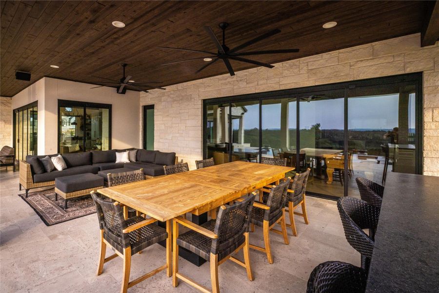 Dining room featuring wood ceiling and ceiling fan