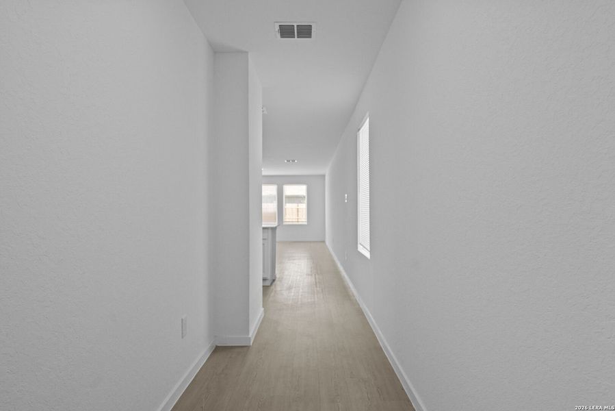 Spacious, unfurnished interior of a new home in Higdon Crossing, San Antonio (Image 13).