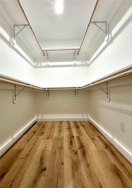 Primary bedroom's large walk-in closet.