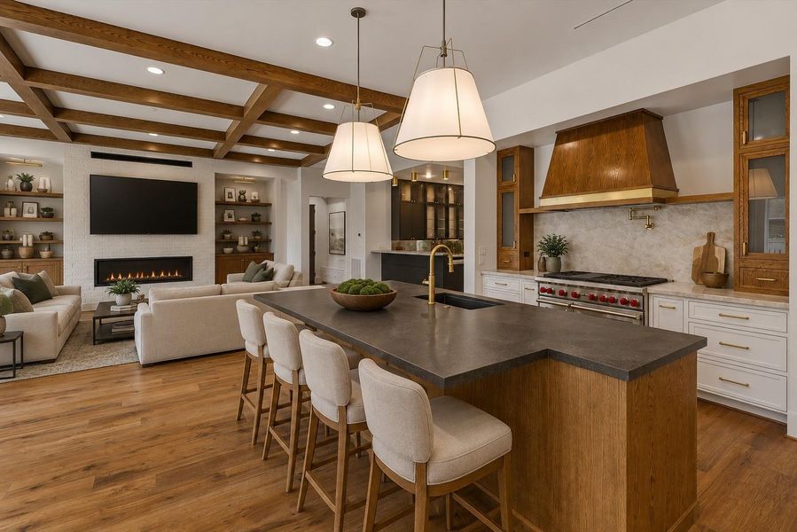 This island has seating for SIX...This stunning open-concept living space seamlessly connects the family room, gourmet kitchen, and designer wet bar, creating an exceptional setting for everyday living and effortless entertaining.  Virtually staged to illustrate furnishing possibilities