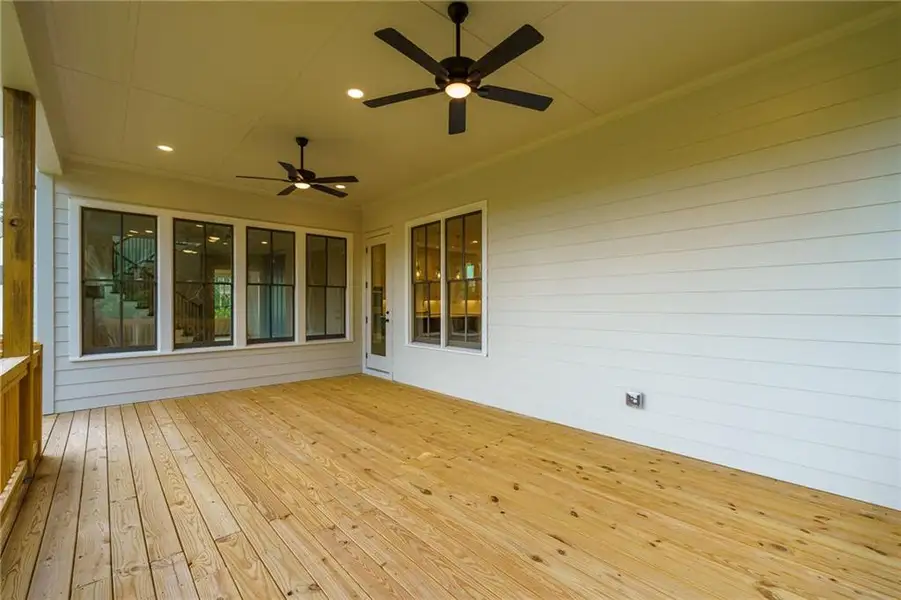 Exterior details and patio area of a home in Malone's Pond, Ball Ground (Image 20).