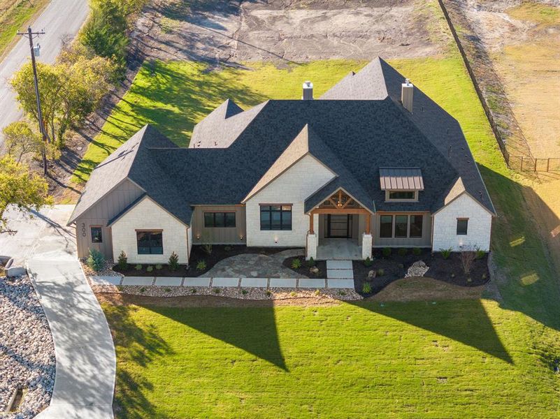 Front exterior of a new home in , Gunter, TX, highlighting curb appeal (Image 29). Front exterior of a new home in , Gunter, TX, highlighting curb appeal (Image 29).