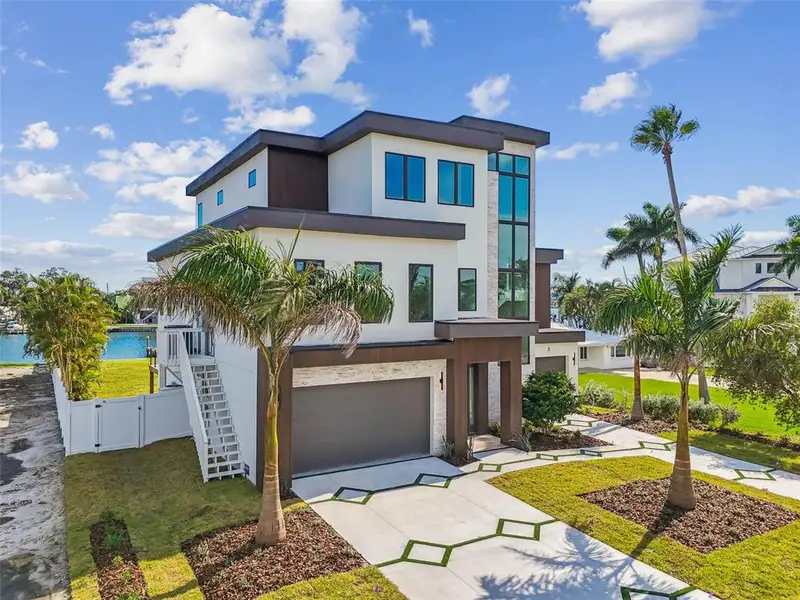 Front exterior of a new home in , Treasure Island, FL, highlighting curb appeal (Image 1). Front exterior of a new home in , Treasure Island, FL, highlighting curb appeal (Image 1).