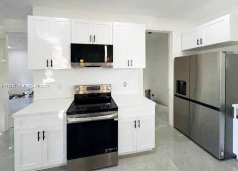 Furnished interior view inside a new home in , Clewiston (Image 12).