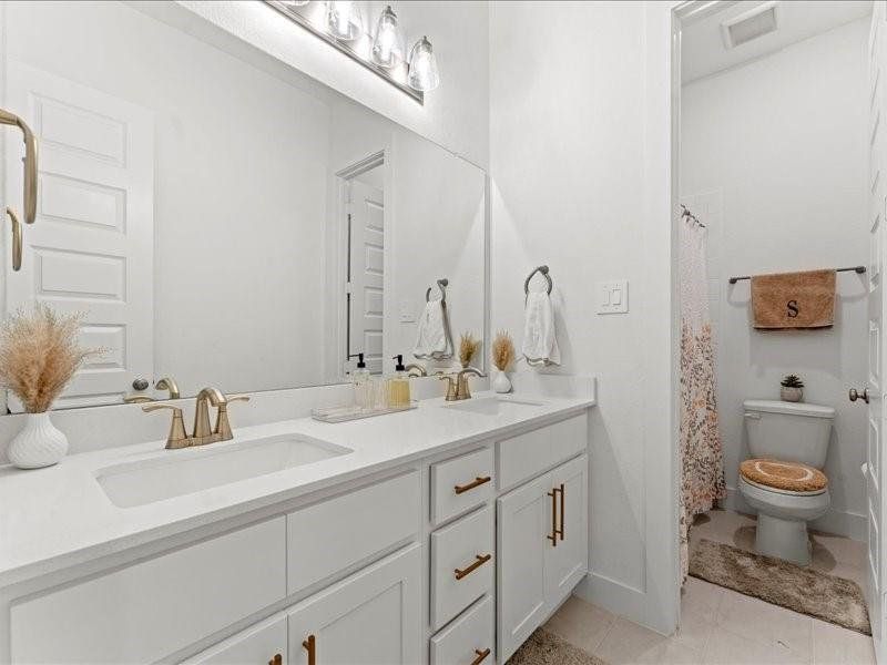 Two sinks are better than one in this convenient shared bathroom. Simply beauty, glamour and function. Two sinks are better than one in this convenient shared bathroom. Simply beauty, glamour and function.