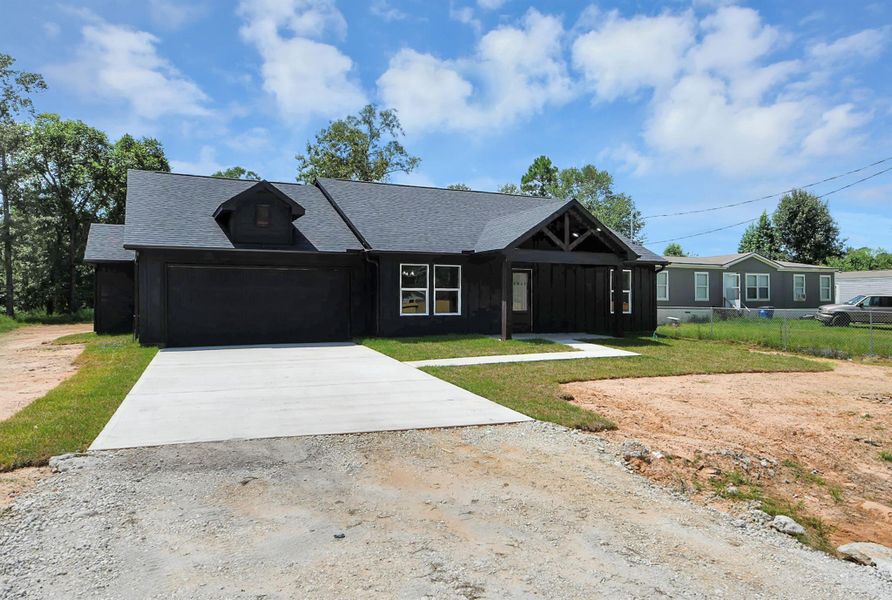 Front exterior of a new home in , Cleveland, TX, highlighting curb appeal (Image 19).