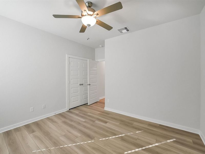 Spacious, unfurnished interior of a new home in Sunterra, Katy (Image 37).