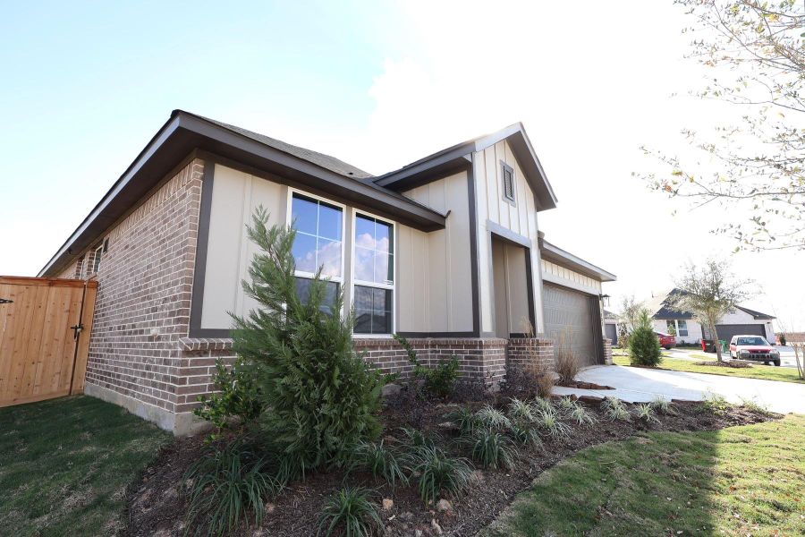 Exterior details and patio area of a home in Mason Woods, Cypress (Image 3).