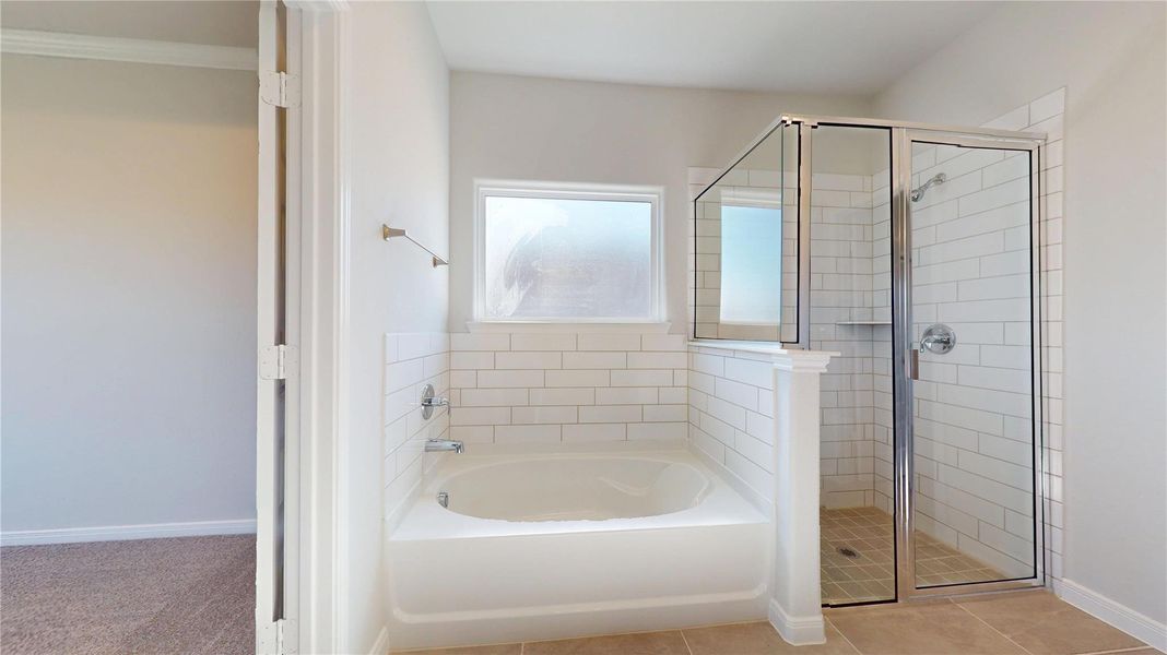 Primary bath features soaking tub and stand up shower Primary bath features soaking tub and stand up shower