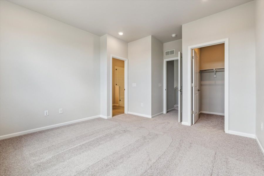 A hallway with white walls. A hallway with white walls.
