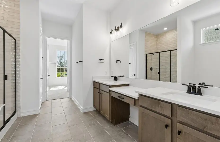 Double vanity in owner's bath