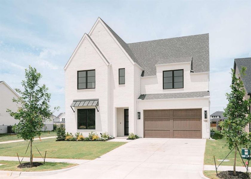 Front exterior of a new home in , Aledo, TX, highlighting curb appeal (Image 1). Front exterior of a new home in , Aledo, TX, highlighting curb appeal (Image 1).