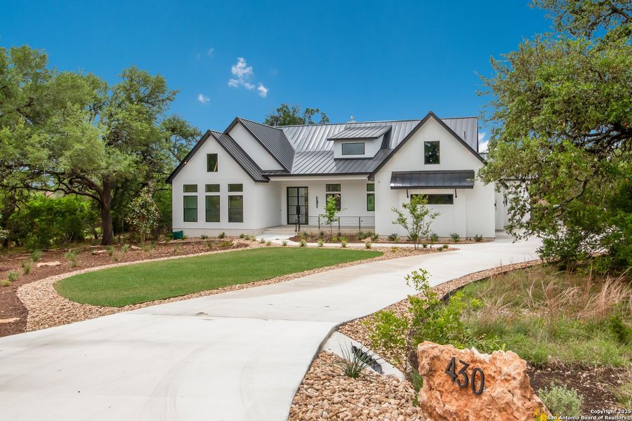 Front exterior of a new home in , Spring Branch, TX, highlighting curb appeal (Image 18). Front exterior of a new home in , Spring Branch, TX, highlighting curb appeal (Image 18).