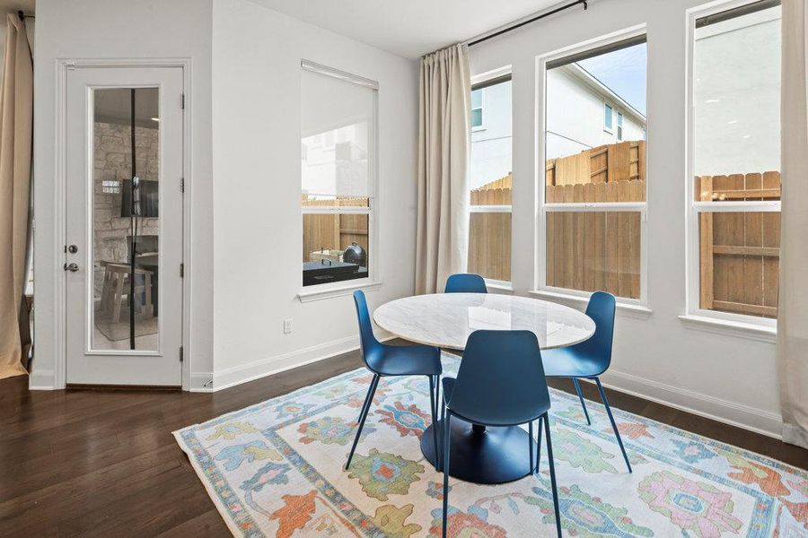 Dining area with wood finished floors and baseboards