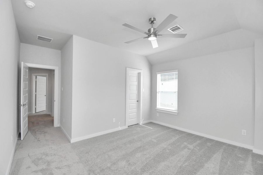 Generously sized secondary bedrooms featuring spacious closets, soft and inviting carpeting underfoot, large windows allowing plenty of natural light, and the added touch of privacy blinds for your personal retreat.