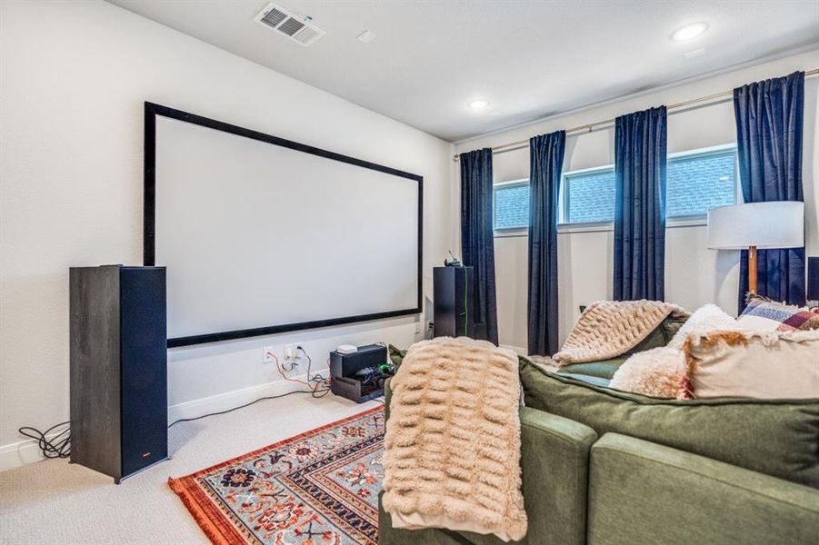 Cinema featuring carpet flooring and recessed lighting