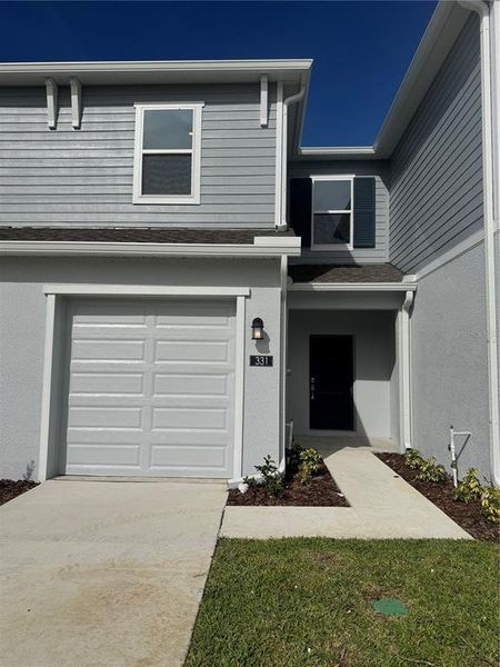 Front exterior of a new home in , Dundee, FL, highlighting curb appeal (Image 1). Front exterior of a new home in , Dundee, FL, highlighting curb appeal (Image 1).